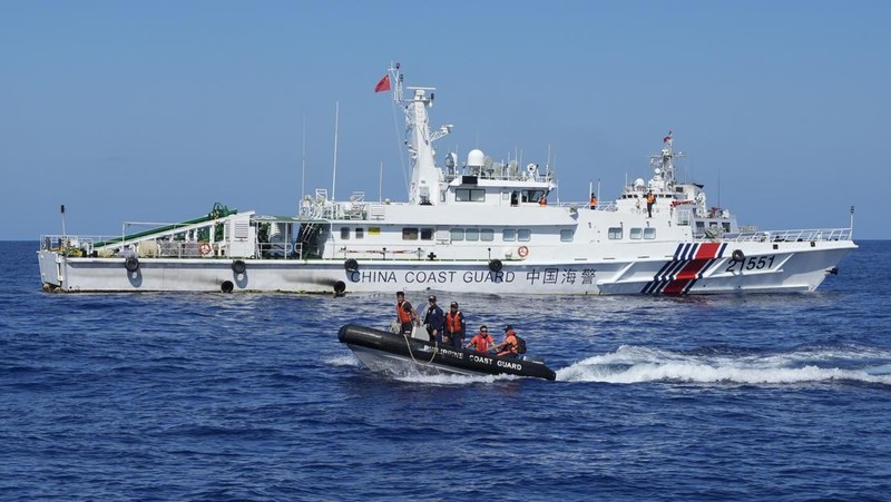 In this image made from video provided by the Philippine Coast Guard, Philippine resupply vessel Unaizah May 4, center, is hit by two Chinese coast guard water canon blasts, causing injuries to multiple crew members as they tried to enter the Second Thomas Shoal, locally known as Ayungin Shoal, in the disputed South China Sea, Tuesday, March 5, 2024. Chinese and Philippine coast guard vessels collided in the disputed South China Sea and multiple Filipino crew members were injured in high-seas confrontations Tuesday as Southeast Asian leaders gathered for a summit that was expected to touch on Beijing's aggression at sea. (Philippine Coast Guard via AP)