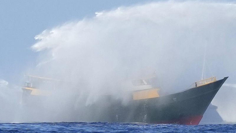 In this image made from video provided by the Philippine Coast Guard, Philippine resupply vessel Unaizah May 4, center, is hit by two Chinese coast guard water canon blasts, causing injuries to multiple crew members as they tried to enter the Second Thomas Shoal, locally known as Ayungin Shoal, in the disputed South China Sea, Tuesday, March 5, 2024. Chinese and Philippine coast guard vessels collided in the disputed South China Sea and multiple Filipino crew members were injured in high-seas confrontations Tuesday as Southeast Asian leaders gathered for a summit that was expected to touch on Beijing's aggression at sea. (Philippine Coast Guard via AP)