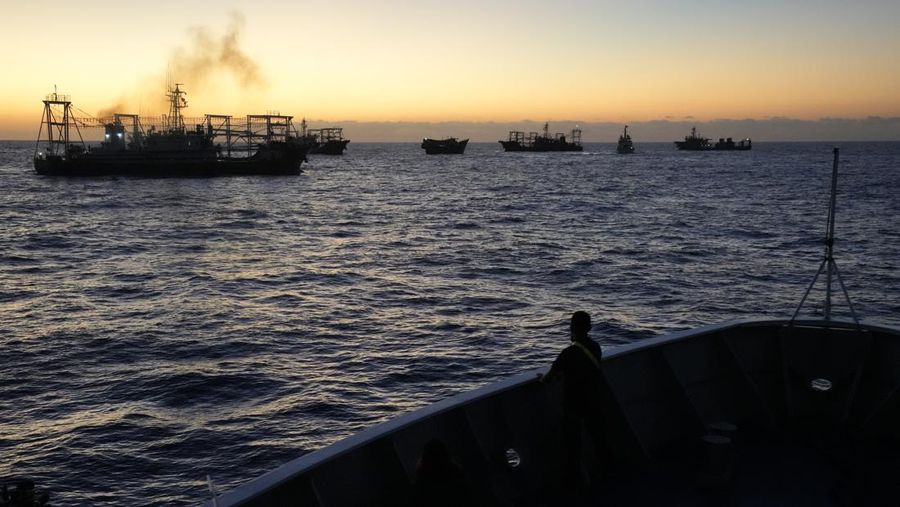 Chinese militia ships prepare to block the path of Philippine coast guard BRP Sindangan, bottom, as they tried to enter the Second Thomas Shoal, locally known as Ayungin Shoal, in the disputed South China Sea Tuesday, March 5, 2024. Chinese and Philippine coast guard vessels collided in the disputed South China Sea and four Filipino crew members were injured in high-seas confrontations Tuesday as Southeast Asian leaders gathered for a summit that was expected to touch on Beijing's aggression at sea. (AP Photo/Aaron Favila)