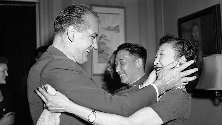 Senator Joseph McCarthy greets a smiling Madame L.K. Wellington Koo, wife of the Chinese ambassador, clasping her head between his hands, at a reception in the Chinese Embassy on Feb. 26, 1953. Its so nice to see you again,