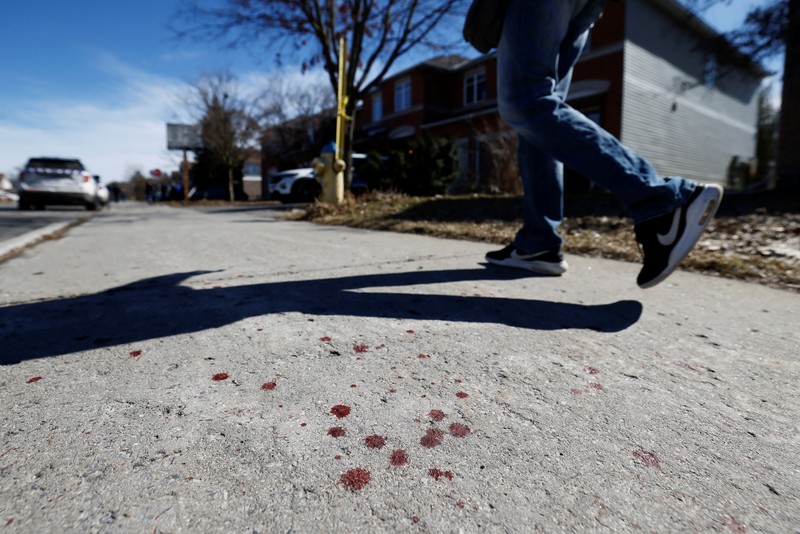 CANADA-OTTAWA/CASUALTIES Ottawa Police Service officers surround a home after four children and two adults were found dead inside a neighbouring house in the Ottawa suburb of Barrhaven, Ontario, Canada March 7, 2024. REUTERS/Blair Gable