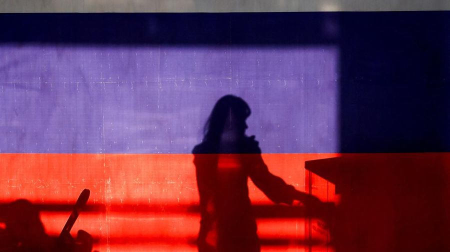 A view shows a screen informing of Russia's presidential election, with the building of Moscow State University (MSU) in the background, in Moscow, Russia March 15, 2024.  REUTERS/Stringer