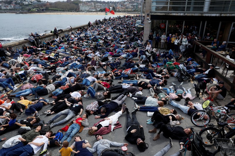 Spain Israel Palestinians Pro-Palestinian demonstrators lie on the ground as they protest against Israeli attacks on Gaza, in San Sebastian, northern Spain, on Sunday, March 17, 2024. (AP Photo/Alvaro Barrientos)