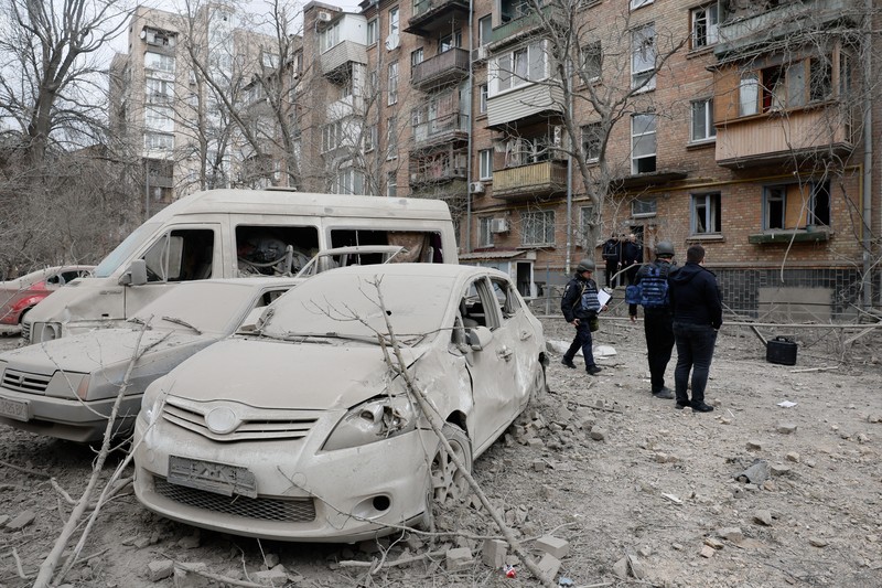 Rescuers work at the site of a building damaged by a Russian missile strike, amid Russia's attack on Ukraine, in Kyiv, Ukraine, March 25, 2024. REUTERS/Valentyn Ogirenko