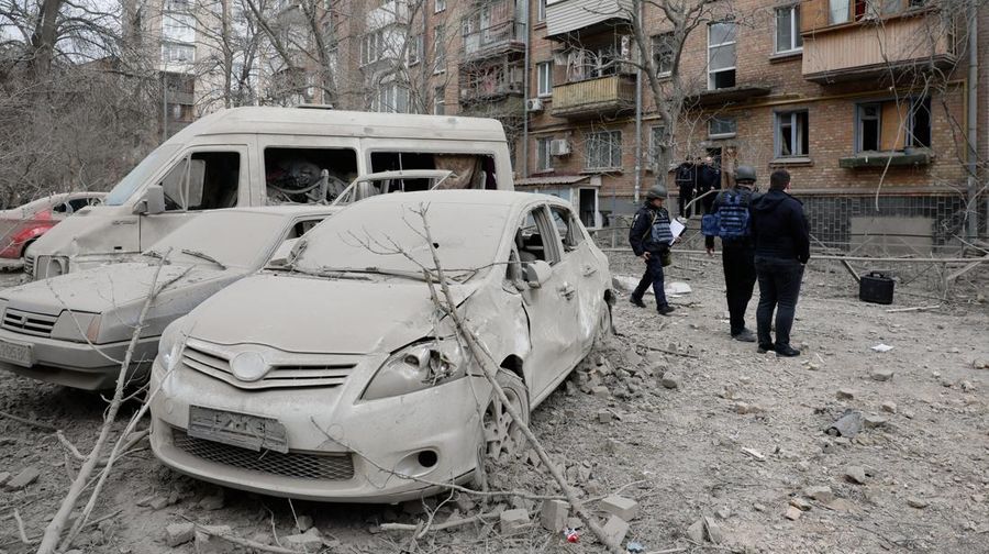 Rescuers work at the site of a building damaged by a Russian missile strike, amid Russia's attack on Ukraine, in Kyiv, Ukraine, March 25, 2024. REUTERS/Valentyn Ogirenko