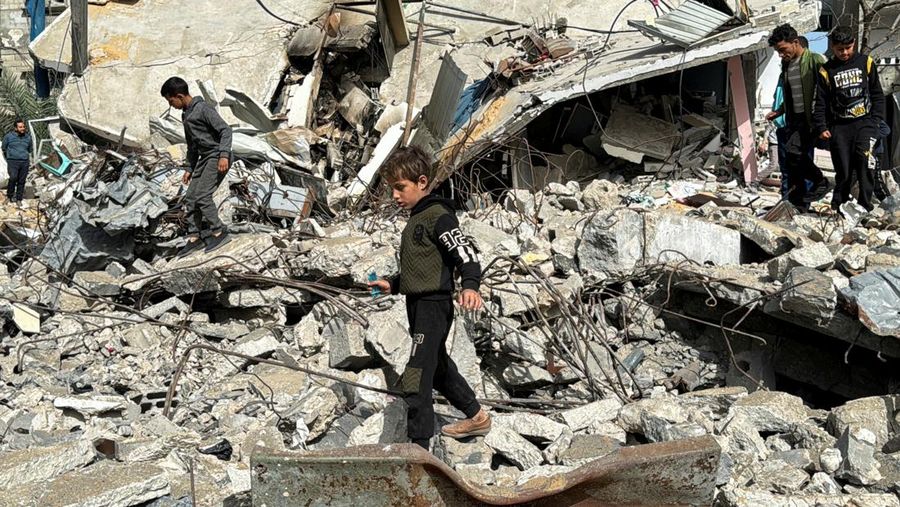 A Palestinian boy walks on the site of an Israeli strike, amid the ongoing conflict between Israel and the Palestinian Islamist group Hamas, in Rafah, in the southern Gaza Strip, March 27, 2024. REUTERS/Bassam Masoud     TPX IMAGES OF THE DAY