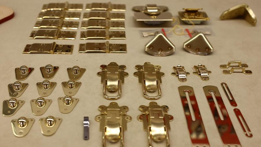 The brass jewelry from a Louis Vuitton trunk is placed on a work table during a press visit at the Louis Vuitton workshops in Asnieres-sur-Seine near Paris, France, March 27, 2024. REUTERS/Stephanie Lecocq