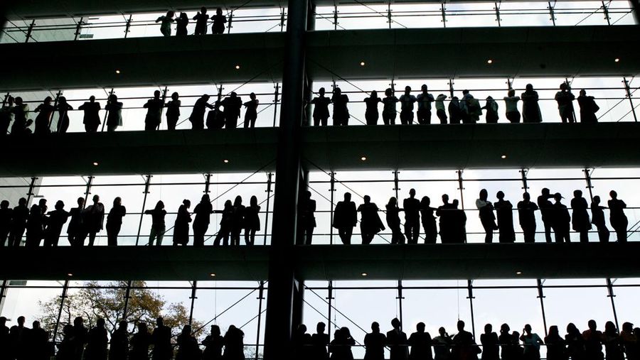 FILE - In this Oct. 30, 2007 file photo, employees are silhouetted at the Boehringer Ingelheim pharmaceutical factory in Ingelheim, central Germany. Official data shows that Germany’s unemployment rate dipped to 5.6% in July. Such a decline is unusual for the summer month and shows that Europe’s biggest economy is recovering from the COVID-19 pandemic. (AP Photo/Michael Pobst, file)