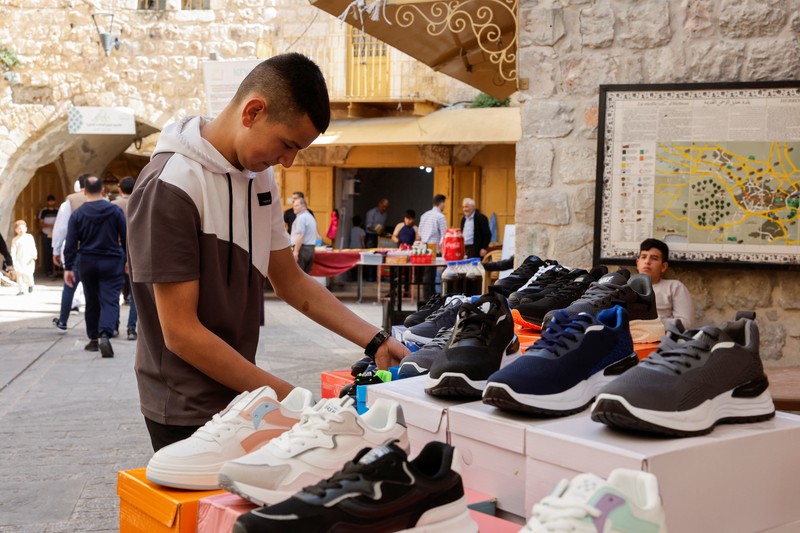 Palestinians prepare for Eid al-Fitr, amid the ongoing conflict between Israel and the Palestinian Islamist group Hamas, in Nablus, in the Israeli-occupied West Bank, April 6, 2024. REUTERS/Raneen Sawafta