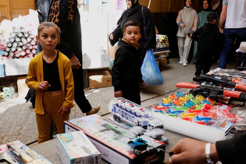 Palestinians prepare for Eid al-Fitr, amid the ongoing conflict between Israel and the Palestinian Islamist group Hamas, in Nablus, in the Israeli-occupied West Bank, April 6, 2024. REUTERS/Raneen Sawafta