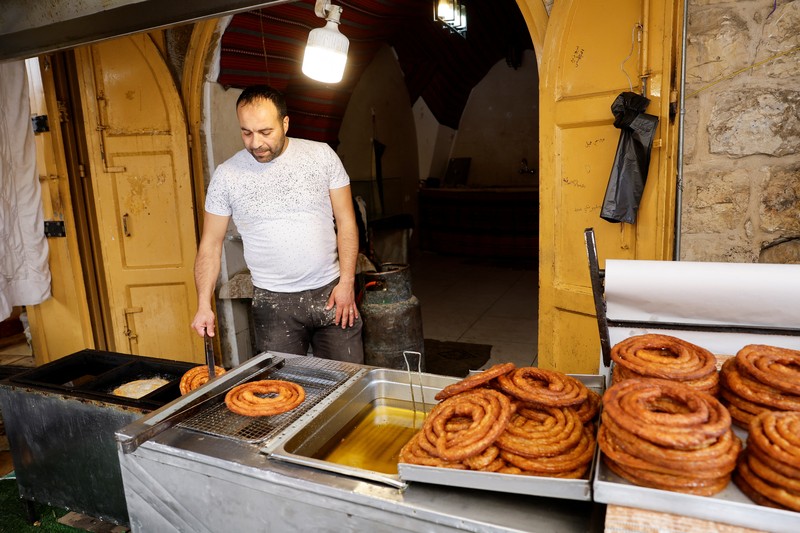 Palestinians prepare for Eid al-Fitr, amid the ongoing conflict between Israel and the Palestinian Islamist group Hamas, in Nablus, in the Israeli-occupied West Bank, April 6, 2024. REUTERS/Raneen Sawafta