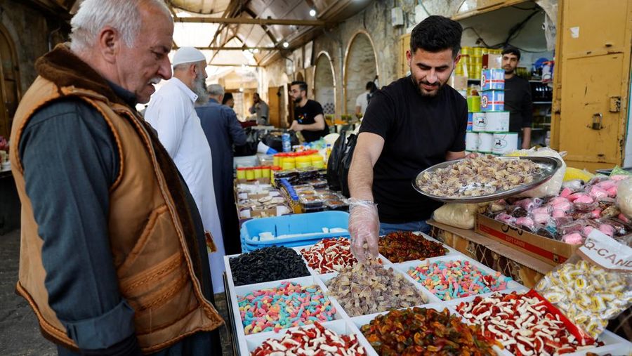 Palestinians prepare for Eid al-Fitr, amid the ongoing conflict between Israel and the Palestinian Islamist group Hamas, in Nablus, in the Israeli-occupied West Bank, April 6, 2024. REUTERS/Raneen Sawafta