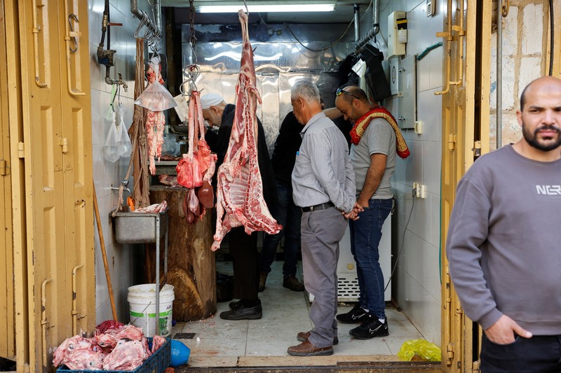 Palestinians prepare for Eid al-Fitr, amid the ongoing conflict between Israel and the Palestinian Islamist group Hamas, in Nablus, in the Israeli-occupied West Bank, April 6, 2024. REUTERS/Raneen Sawafta