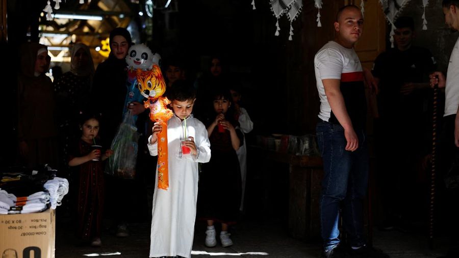 Palestinians prepare for Eid al-Fitr, amid the ongoing conflict between Israel and the Palestinian Islamist group Hamas, in Nablus, in the Israeli-occupied West Bank, April 6, 2024. REUTERS/Raneen Sawafta