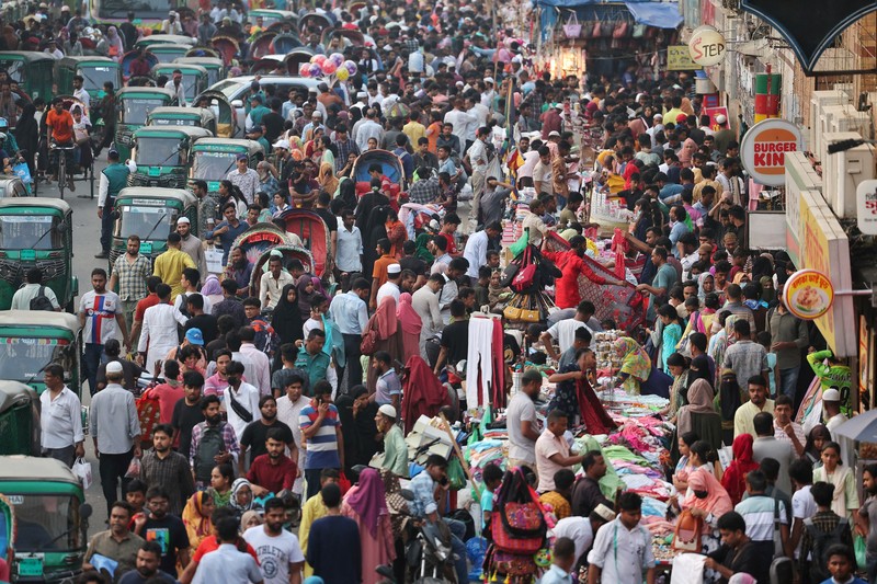 People get into a ferry at the Sadarghat Ferry Terminal to go home to celebrate Eid al-Fitr with their family, in Dhaka, Bangladesh, April 8, 2024. REUTERS/Mohammad Ponir Hossain