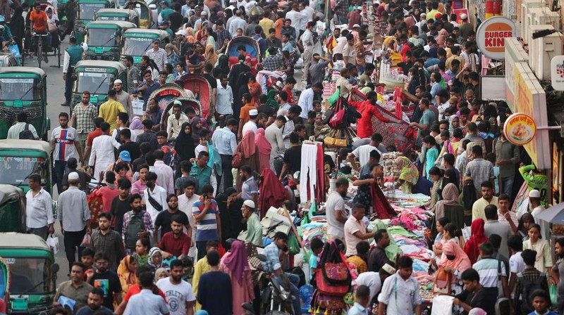 People get into a ferry at the Sadarghat Ferry Terminal to go home to celebrate Eid al-Fitr with their family, in Dhaka, Bangladesh, April 8, 2024. REUTERS/Mohammad Ponir Hossain