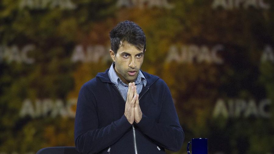 Palestinian Mosab Hassan Yousef gestures to the audience after speaking at the American Israel Public Affairs Committee (AIPAC) Policy Conference in Washington, Sunday, March 1, 2015. Youssef worked undercover for Israel's internal security service Shin Bet from 1997 to 2007. (AP Photo/Cliff Owen)