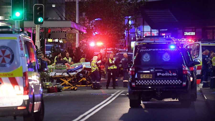 Emergency service workers are seen near Bondi Junction after multiple people were stabbed inside the Westfield Bondi Junction shopping centre in Sydney, April 13, 2024.AAP Image/Steven Saphore via REUTERS   ATTENTION EDITORS - THIS IMAGE WAS PROVIDED BY A THIRD PARTY. NO RESALES. NO ARCHIVE. AUSTRALIA OUT. NEW ZEALAND OUT. NO COMMERCIAL OR EDITORIAL SALES IN NEW ZEALAND. NO COMMERCIAL OR EDITORIAL SALES IN AUSTRALIA.