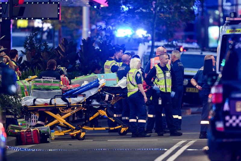 Emergency service workers are seen near Bondi Junction after multiple people were stabbed inside the Westfield Bondi Junction shopping centre in Sydney, April 13, 2024.AAP Image/Steven Saphore via REUTERS   ATTENTION EDITORS - THIS IMAGE WAS PROVIDED BY A THIRD PARTY. NO RESALES. NO ARCHIVE. AUSTRALIA OUT. NEW ZEALAND OUT. NO COMMERCIAL OR EDITORIAL SALES IN NEW ZEALAND. NO COMMERCIAL OR EDITORIAL SALES IN AUSTRALIA.