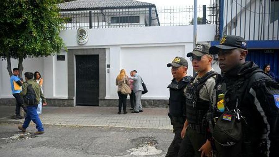 Police guard outside the Mexican embassy in Quito on April 8, 2024. (Photo by Rodrigo BUENDIA / AFP)