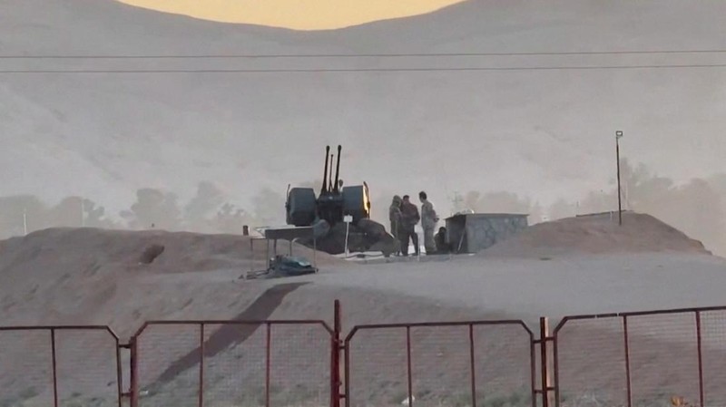 Military personnel stand guard at a nuclear facility in the Zardanjan area of Isfahan, Iran, April 19, 2024, in this screengrab taken from video.  WANA (West Asia News Agency) via REUTERS   ATTENTION EDITORS - THIS PICTURE WAS PROVIDED BY A THIRD PARTY. IRAN OUT. NO COMMERCIAL OR EDITORIAL SALES IN IRAN