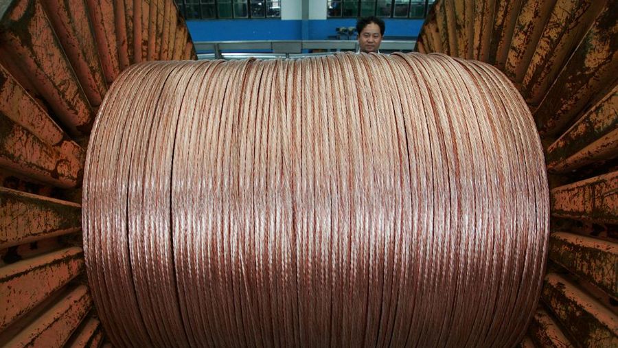 FILE PHOTO: An employee works at a electricity cable factory in Baoying, Jiangsu province, July 23, 2006. REUTERS/Aly Song/File Photo