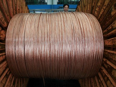 FILE PHOTO: An employee works at a electricity cable factory in Baoying, Jiangsu province, July 23, 2006. REUTERS/Aly Song/File Photo