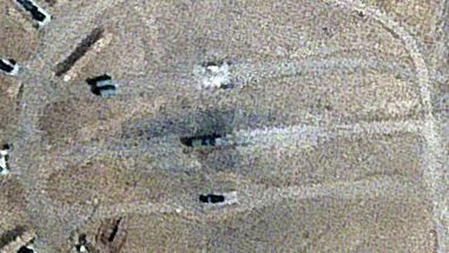 Burn marks surround what analysts identify as a radar system for a Russian-made S-300 missile battery, center, near an international airport and air base is seen in Isfahan, Iran, Monday, April 22, 2024. Satellite photos taken Monday suggest an apparent Israeli retaliatory strike targeting Iran's central city of Isfahan hit a radar system for a Russian-made air defense battery, contradicting repeated denials by officials in Tehran in the time since the assault. (Planet Labs PBC via AP)