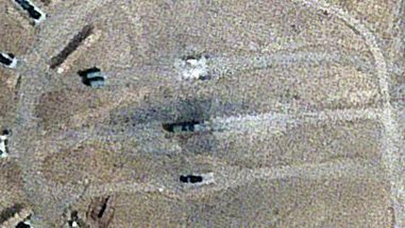 Burn marks surround what analysts identify as a radar system for a Russian-made S-300 missile battery, center, near an international airport and air base is seen in Isfahan, Iran, Monday, April 22, 2024. Satellite photos taken Monday suggest an apparent Israeli retaliatory strike targeting Iran's central city of Isfahan hit a radar system for a Russian-made air defense battery, contradicting repeated denials by officials in Tehran in the time since the assault. (Planet Labs PBC via AP)