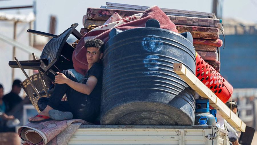 Palestinians travel in a vehicle as they flee Rafah after Israeli forces launched a ground and air operation in the eastern part of the southern Gaza city, amid the ongoing conflict between Israel and Hamas, in the southern Gaza Strip May 9, 2024. REUTERS/Mohammed Salem