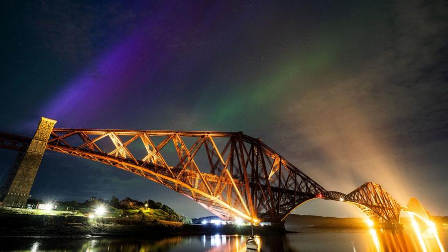 Aurora Borealis, or the Northern Lights, above the Forth Bridge at North Queensferry, Scotland Friday May 10, 2024. (Jane Barlow/PA via AP)
