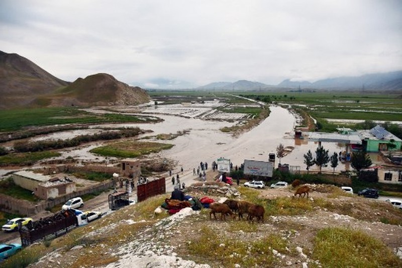 AFGHANISTAN-WEATHER-FLOOD Afghan relatives offer prayers during a burial ceremony, near the graves of victim who lost their lives following flash floods after heavy rainfall at a village in Baghlan-e-Markazi district of Baghlan province on May 11, 2024. More than 300 people were killed in flash flooding in Afghanistan's northern province of Baghlan, the World Food Programme said on May 11. (Photo by Atif Aryan / AFP)