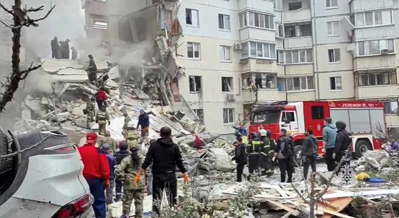 Russia Ukraine In this photo taken from video released by the Russian Emergency Ministry Press Service on Sunday, May 12, 2024, Russian emergency services work at the scene of a partially collapsed block of flats authorities said was hit during an attack by Ukrainian shelling, in Belgorod, Russia. (Russian Emergency Ministry Press Service via AP)