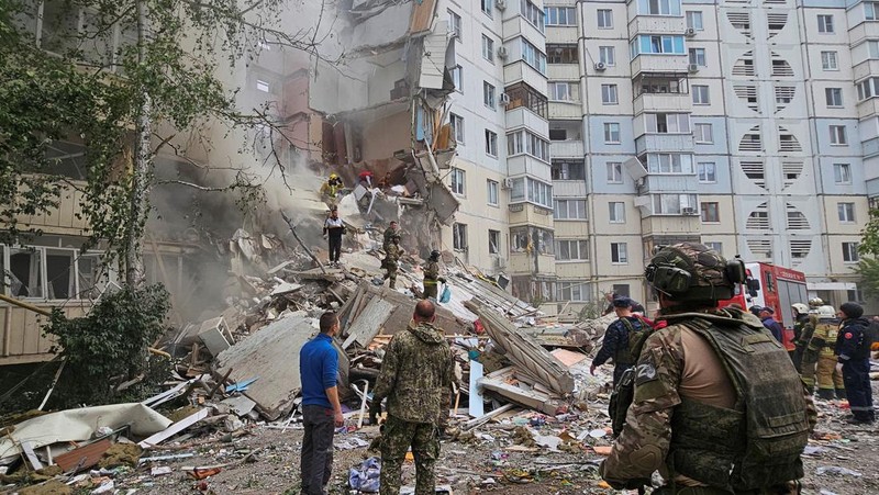 In this photo taken from video released by the Russian Emergency Ministry Press Service on Sunday, May 12, 2024, Russian emergency services work at the scene of a partially collapsed block of flats authorities said was hit during an attack by Ukrainian shelling, in Belgorod, Russia. (Russian Emergency Ministry Press Service via AP)