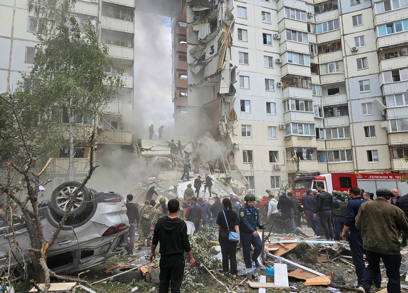 Russia Ukraine In this photo taken from video released by the Russian Emergency Ministry Press Service on Sunday, May 12, 2024, Russian emergency services work at the scene of a partially collapsed block of flats authorities said was hit during an attack by Ukrainian shelling, in Belgorod, Russia. (Russian Emergency Ministry Press Service via AP)
