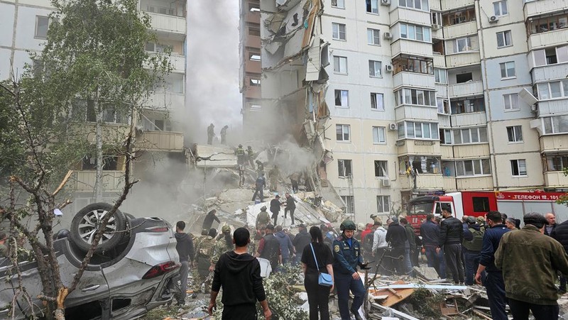 In this photo taken from video released by the Russian Emergency Ministry Press Service on Sunday, May 12, 2024, Russian emergency services work at the scene of a partially collapsed block of flats authorities said was hit during an attack by Ukrainian shelling, in Belgorod, Russia. (Russian Emergency Ministry Press Service via AP)