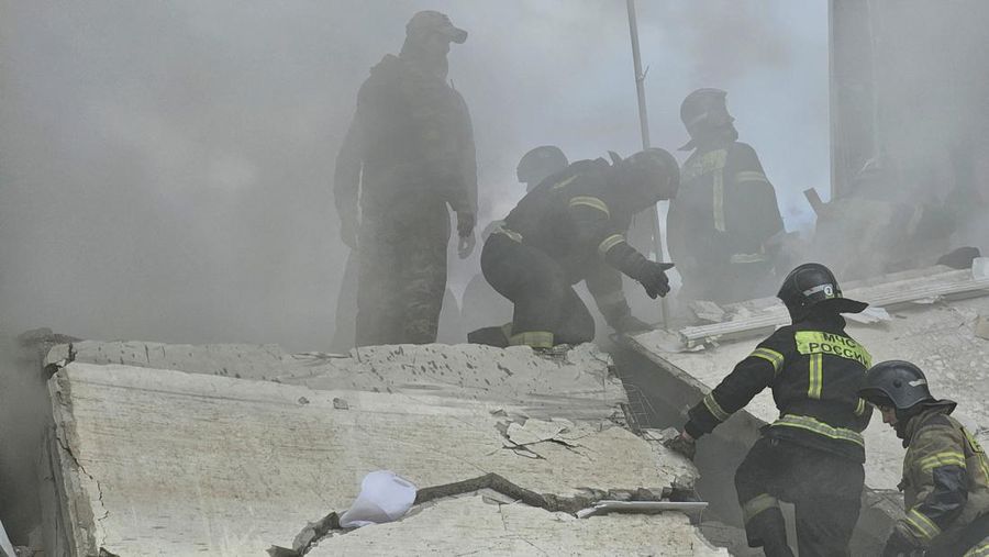 In this photo taken from video released by the Russian Emergency Ministry Press Service on Sunday, May 12, 2024, Russian emergency services work at the scene of a partially collapsed block of flats authorities said was hit during an attack by Ukrainian shelling, in Belgorod, Russia. (Russian Emergency Ministry Press Service via AP)