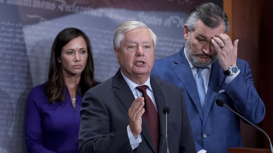 Sen. Lindsey Graham, R-S.C., flanked by Sen. Katie Britt, R-Ala., left, and Sen. Ted Cruz, R-Texas, criticizes President Joe Biden for his warning to Israel that the U.S. will pause more offensive military assistance if it goes through with an all-out assault on Rafah, during a news conference at the Capitol in Washington, Thursday, May 9, 2024. (AP Photo/J. Scott Applewhite)