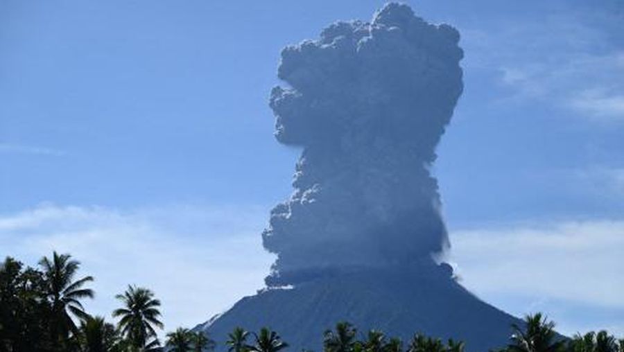 This handout photo taken and released by the Center for Volcanology and Geological Hazard Mitigation (PVMBG) on May 13, 2024 shows Mount Ibu spewing thick smoke in Indonesia's North Maluku Province. A volcano in eastern Indonesia erupted on May 13, spewing a huge ash tower more than five kilometres (three miles) into the sky after authorities raised its alert level to the second-highest last week. (Photo by Handout / Center for Volcanology and Geological Hazard Mitigation (PVMBG) / AFP) / RESTRICTED TO EDITORIAL USE - MANDATORY CREDIT 