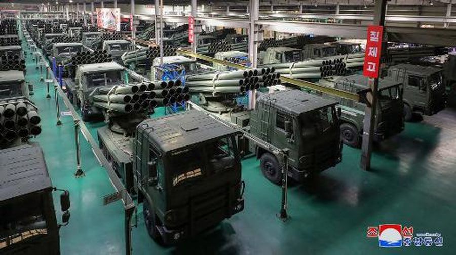 This recent undated picture released by North Korea's official Korean Central News Agency (KCNA) via KNS on May 13, 2024 shows North Korea's leader Kim Jong Un (C) inspecting carriers with a 240mm multiple rocket launcher system while visiting a national defence industrial enterprise at an undisclosed location in North Korea. (Photo by KCNA VIA KNS / AFP) / South Korea OUT / REPUBLIC OF KOREA OUT
---EDITORS NOTE--- RESTRICTED TO EDITORIAL USE - MANDATORY CREDIT 