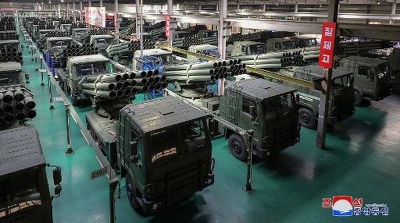 This recent undated picture released by North Korea's official Korean Central News Agency (KCNA) via KNS on May 13, 2024 shows North Korea's leader Kim Jong Un (C) inspecting carriers with a 240mm multiple rocket launcher system while visiting a national defence industrial enterprise at an undisclosed location in North Korea. (Photo by KCNA VIA KNS / AFP) / South Korea OUT / REPUBLIC OF KOREA OUT
---EDITORS NOTE--- RESTRICTED TO EDITORIAL USE - MANDATORY CREDIT 