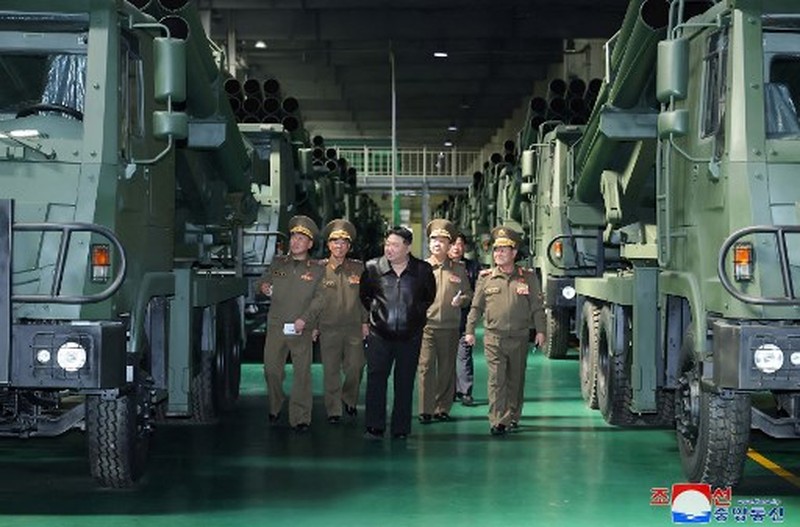 NKOREA-DEFENCE-MILITARY This recent undated picture released by North Korea's official Korean Central News Agency (KCNA) via KNS on May 13, 2024 shows North Korea's leader Kim Jong Un (C) inspecting carriers with a 240mm multiple rocket launcher system while visiting a national defence industrial enterprise at an undisclosed location in North Korea. (Photo by KCNA VIA KNS / AFP) / South Korea OUT / REPUBLIC OF KOREA OUT
---EDITORS NOTE--- RESTRICTED TO EDITORIAL USE - MANDATORY CREDIT