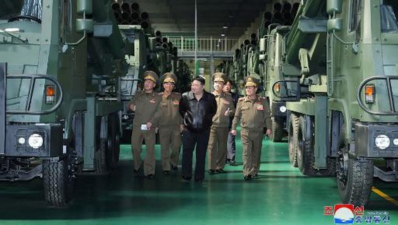 This recent undated picture released by North Korea's official Korean Central News Agency (KCNA) via KNS on May 13, 2024 shows North Korea's leader Kim Jong Un (C) inspecting carriers with a 240mm multiple rocket launcher system while visiting a national defence industrial enterprise at an undisclosed location in North Korea. (Photo by KCNA VIA KNS / AFP) / South Korea OUT / REPUBLIC OF KOREA OUT
---EDITORS NOTE--- RESTRICTED TO EDITORIAL USE - MANDATORY CREDIT 