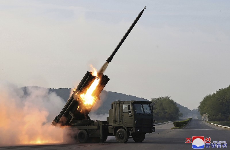 NKOREA-DEFENCE-MILITARY This recent undated picture released by North Korea's official Korean Central News Agency (KCNA) via KNS on May 13, 2024 shows North Korea's leader Kim Jong Un (C) inspecting carriers with a 240mm multiple rocket launcher system while visiting a national defence industrial enterprise at an undisclosed location in North Korea. (Photo by KCNA VIA KNS / AFP) / South Korea OUT / REPUBLIC OF KOREA OUT
---EDITORS NOTE--- RESTRICTED TO EDITORIAL USE - MANDATORY CREDIT