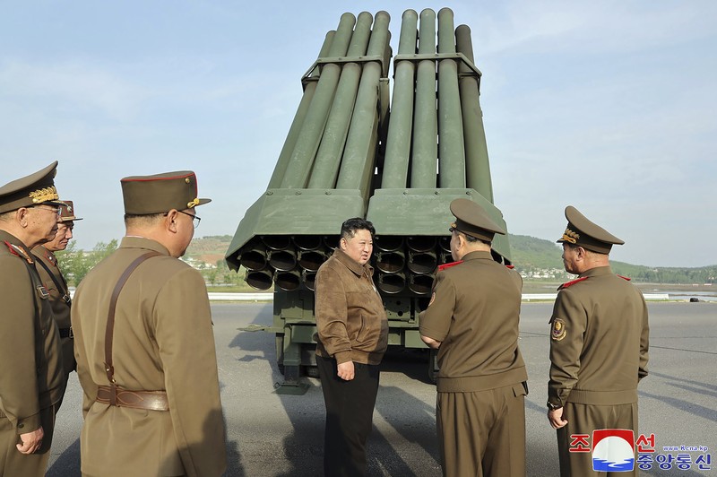 NKOREA-DEFENCE-MILITARY This recent undated picture released by North Korea's official Korean Central News Agency (KCNA) via KNS on May 13, 2024 shows North Korea's leader Kim Jong Un (C) inspecting carriers with a 240mm multiple rocket launcher system while visiting a national defence industrial enterprise at an undisclosed location in North Korea. (Photo by KCNA VIA KNS / AFP) / South Korea OUT / REPUBLIC OF KOREA OUT
---EDITORS NOTE--- RESTRICTED TO EDITORIAL USE - MANDATORY CREDIT