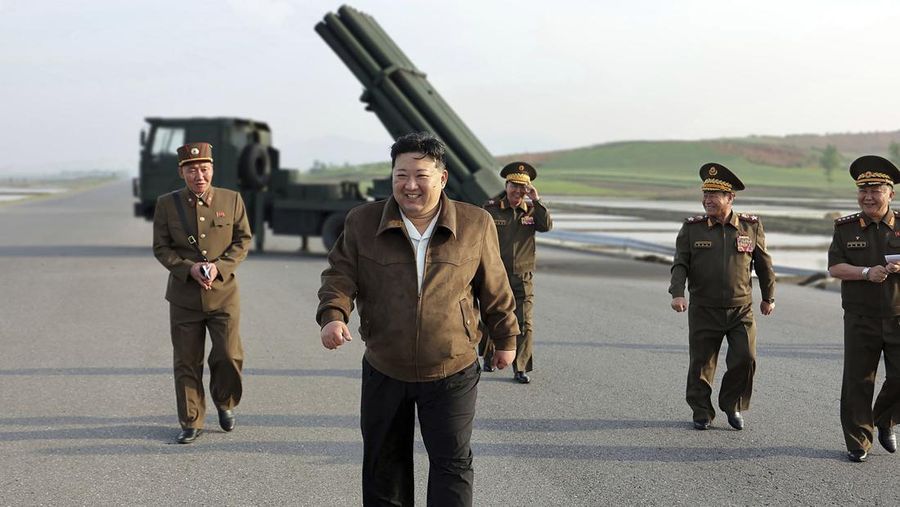 In this photo provided by the North Korean government, North Korean leader Kim Jong Un, center, supervises a test firing of a new multiple rocket launch system at an undisclosed place in North Korea on May 10, 2024. Independent journalists were not given access to cover the event depicted in this image distributed by the North Korean government. The content of this image is as provided and cannot be independently verified. Korean language watermark on image as provided by source reads: