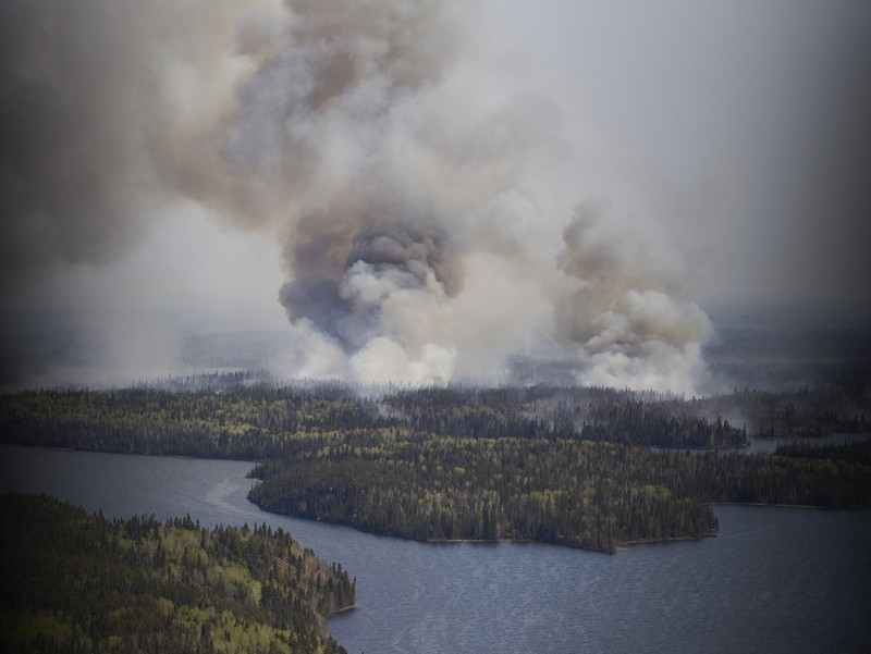 CANADA-WILDFIRE/EXPLAINER FILE PHOTO: Smoke rises from mutual aid wildfire GCU007 in the Grande Prairie Forest Area near TeePee Creek, Alberta, Canada May 10, 2024. Alberta Wildfire/Handout via REUTERS/File Photo