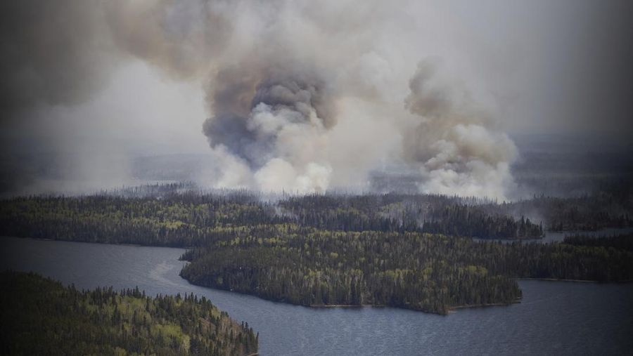 FILE PHOTO: Smoke rises from mutual aid wildfire GCU007 in the Grande Prairie Forest Area near TeePee Creek, Alberta, Canada May 10, 2024. Alberta Wildfire/Handout via REUTERS/File Photo