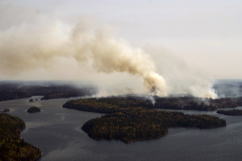 CANADA-WILDFIRE/EXPLAINER FILE PHOTO: Smoke rises from mutual aid wildfire GCU007 in the Grande Prairie Forest Area near TeePee Creek, Alberta, Canada May 10, 2024. Alberta Wildfire/Handout via REUTERS/File Photo
