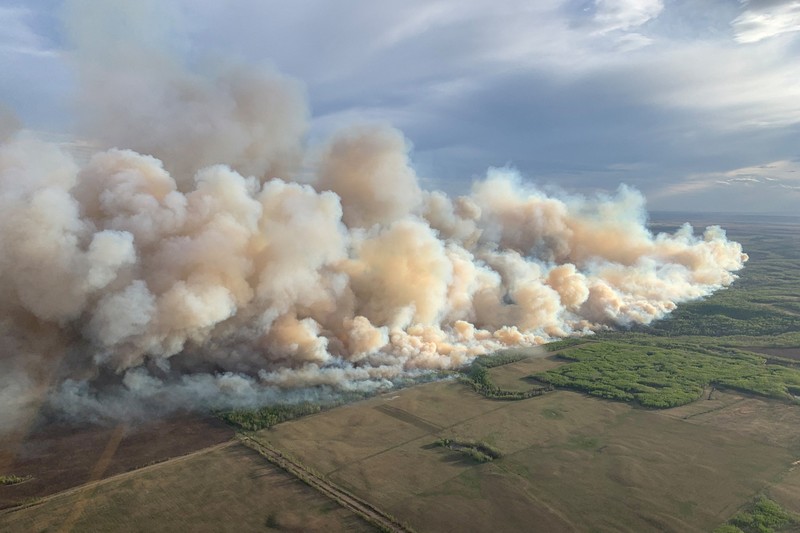 CANADA-WILDFIRE/EXPLAINER FILE PHOTO: Smoke rises from mutual aid wildfire GCU007 in the Grande Prairie Forest Area near TeePee Creek, Alberta, Canada May 10, 2024. Alberta Wildfire/Handout via REUTERS/File Photo